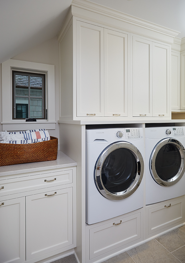 a nice laundry room inside of a beautiful glen lake mansion
