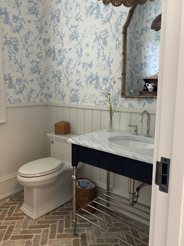 bathroom with custom wallpaper and tile