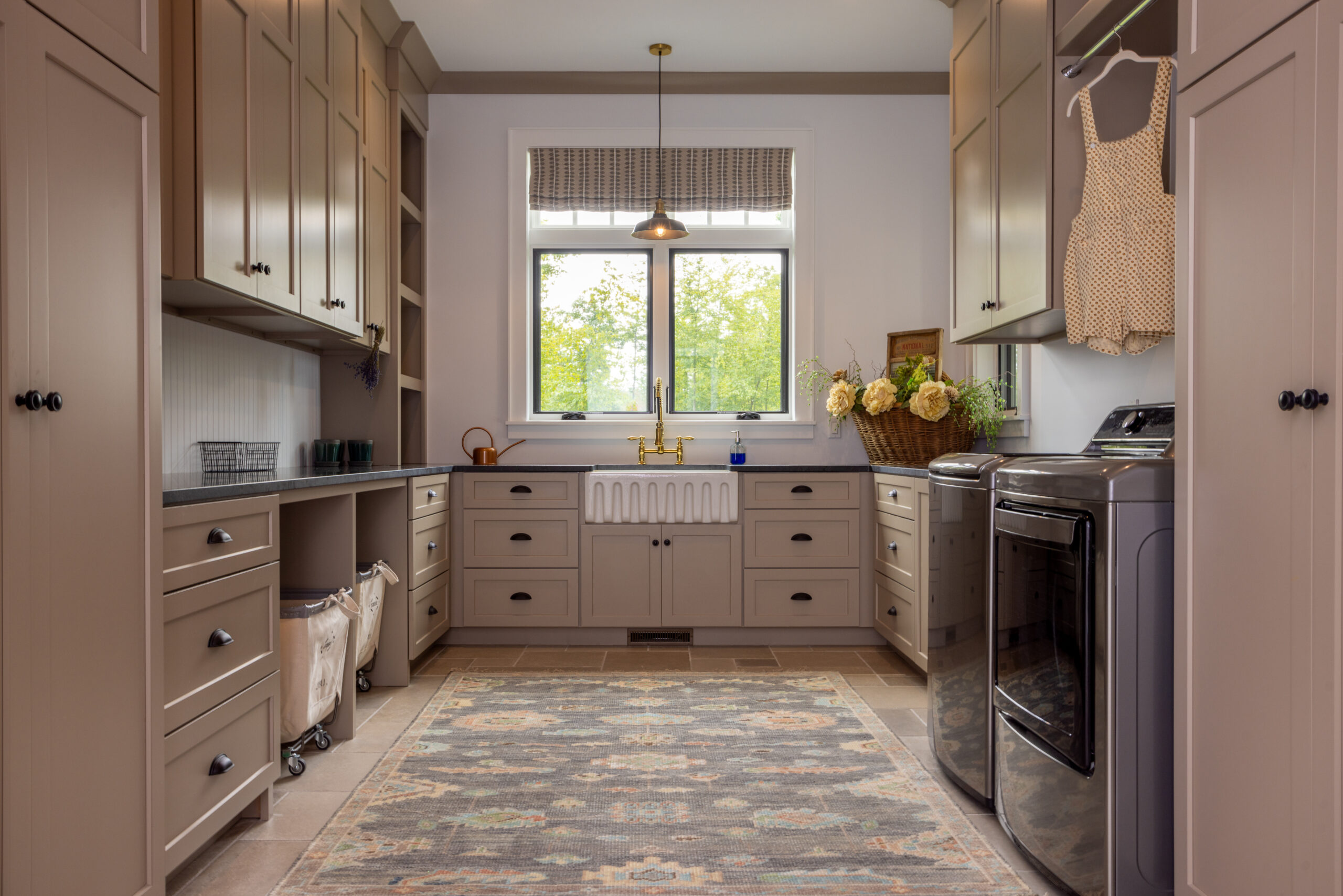 Functional laundry room with farmhouse sink