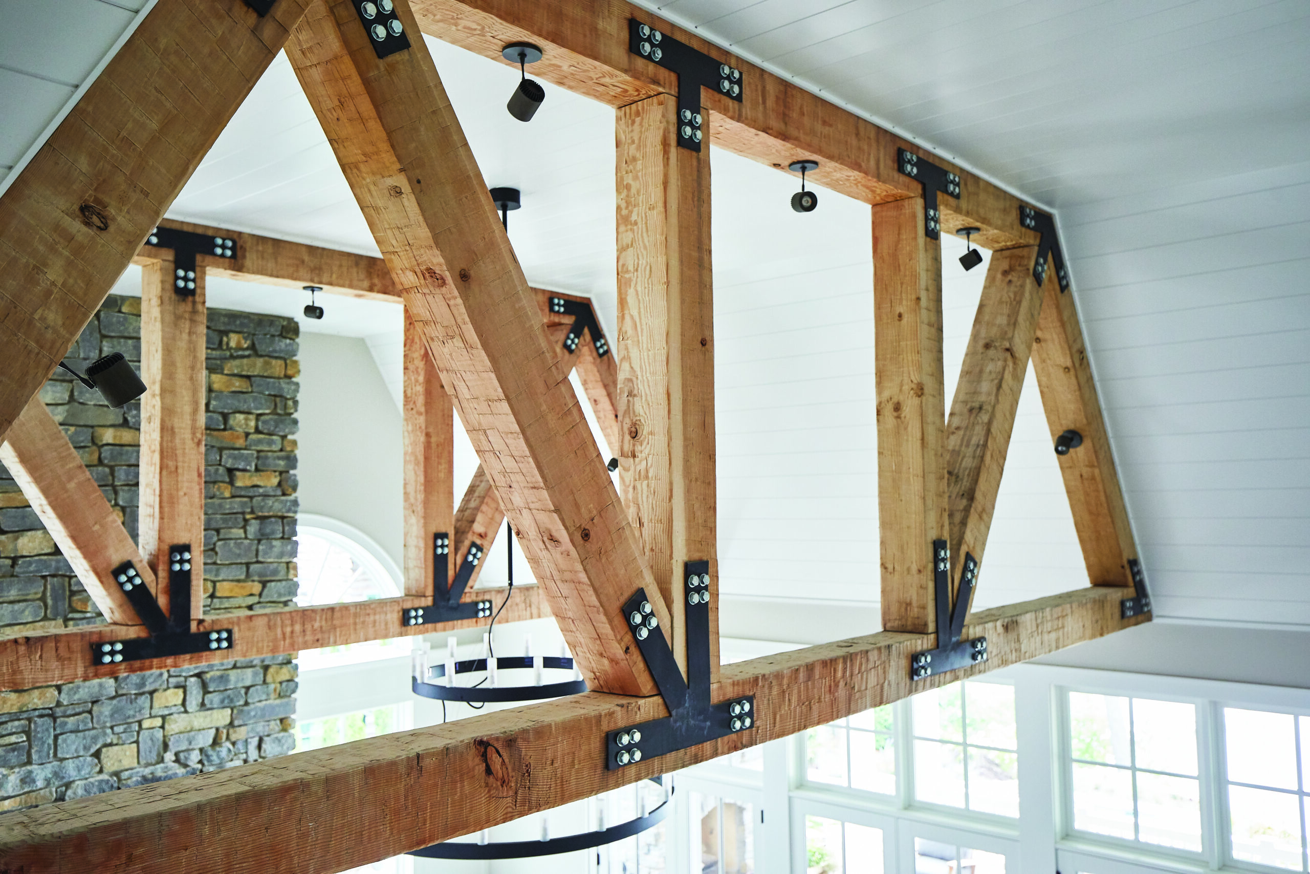 Exposed timber trusses in Glen Arbor great room