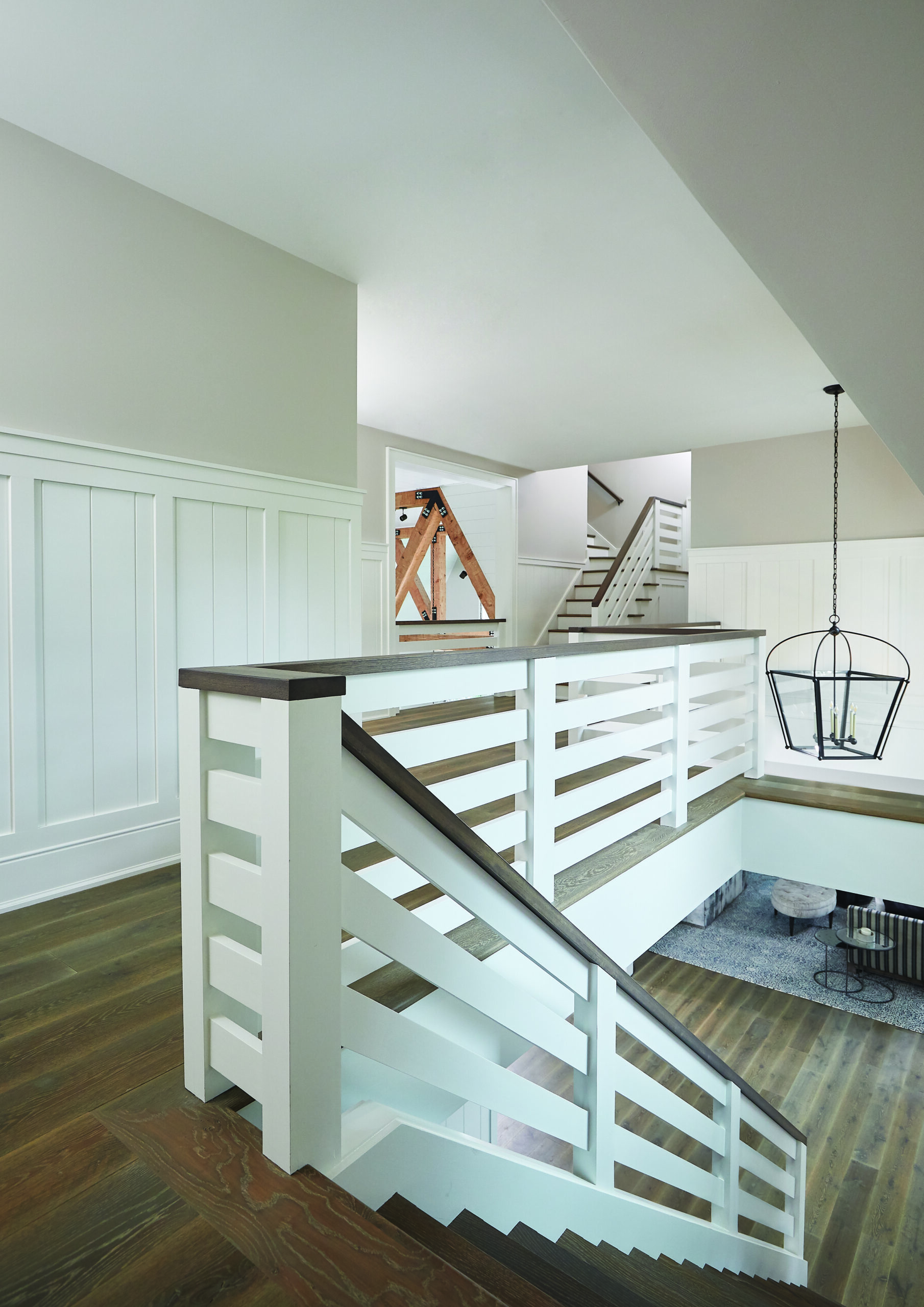 Upper hall and open timber stair system in Glen Arbor lake home