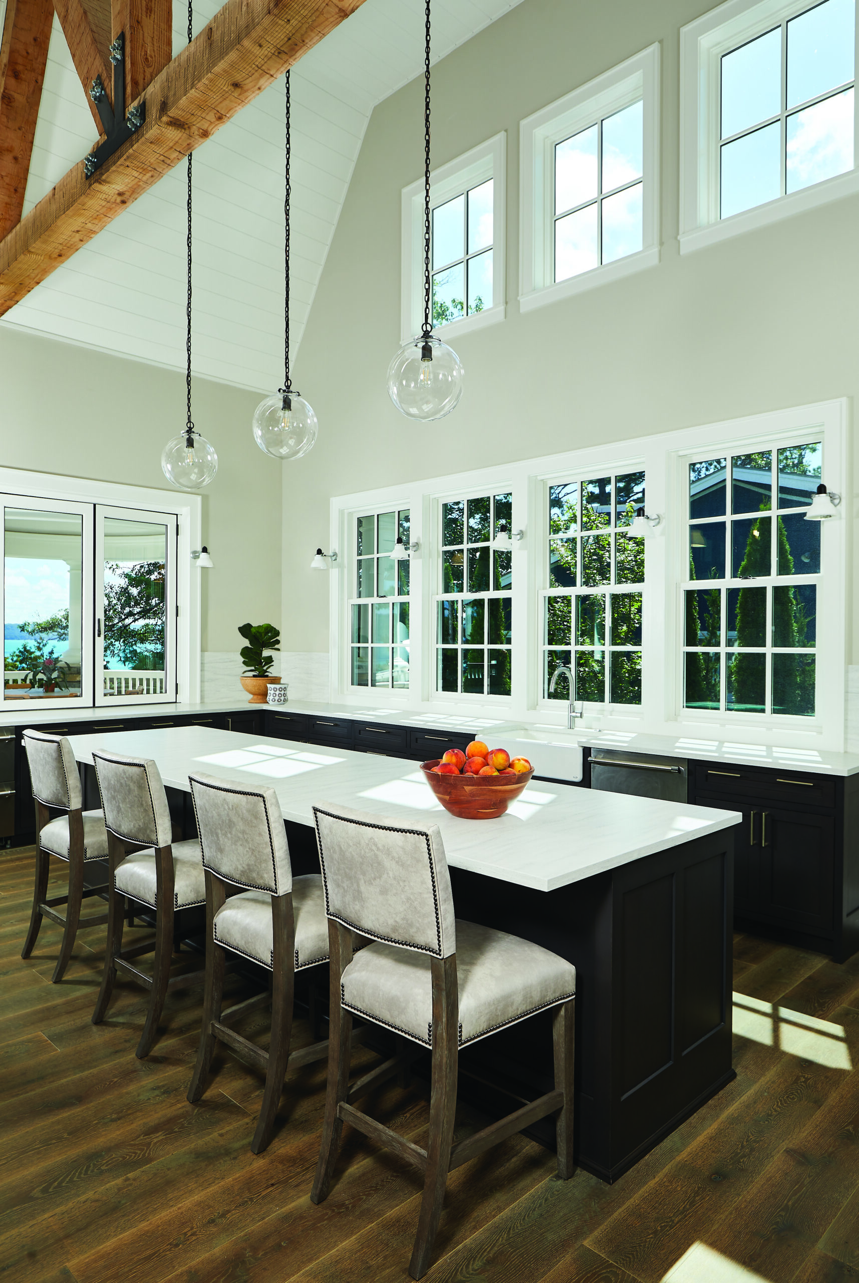 Glen Arbor kitchen island with timber beams and vaulted ceiling
