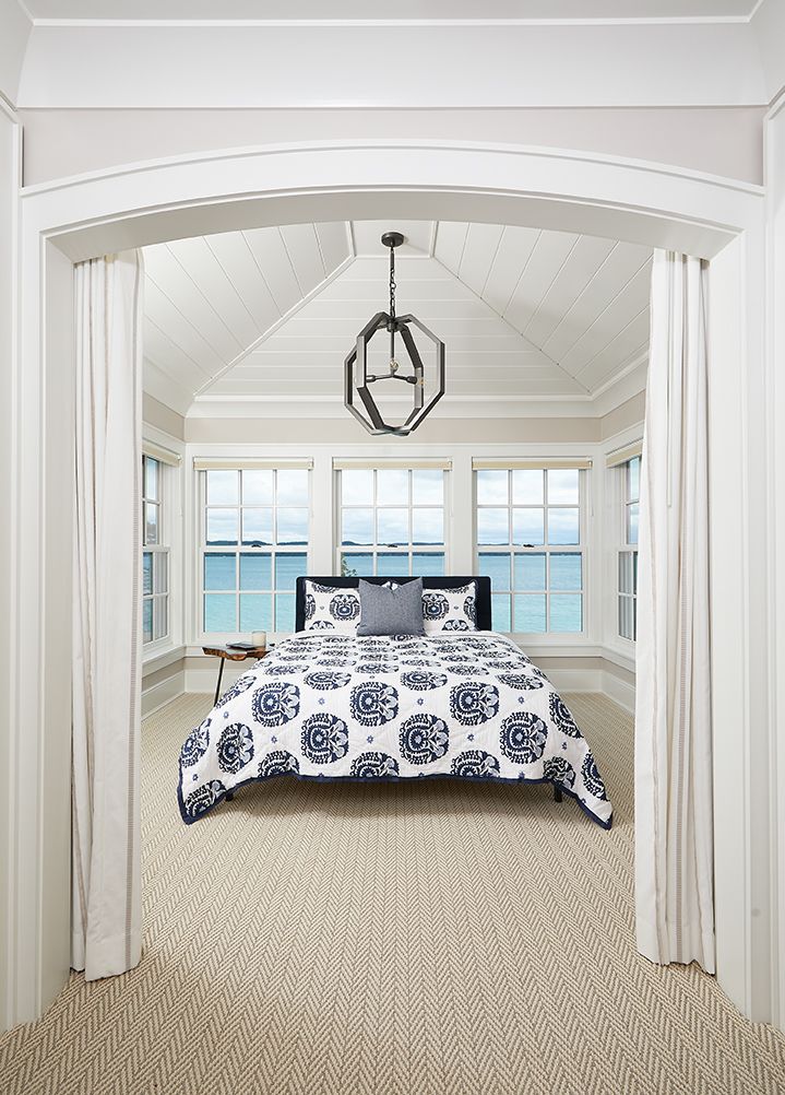 Coastal bedroom with ocean views and arched entry