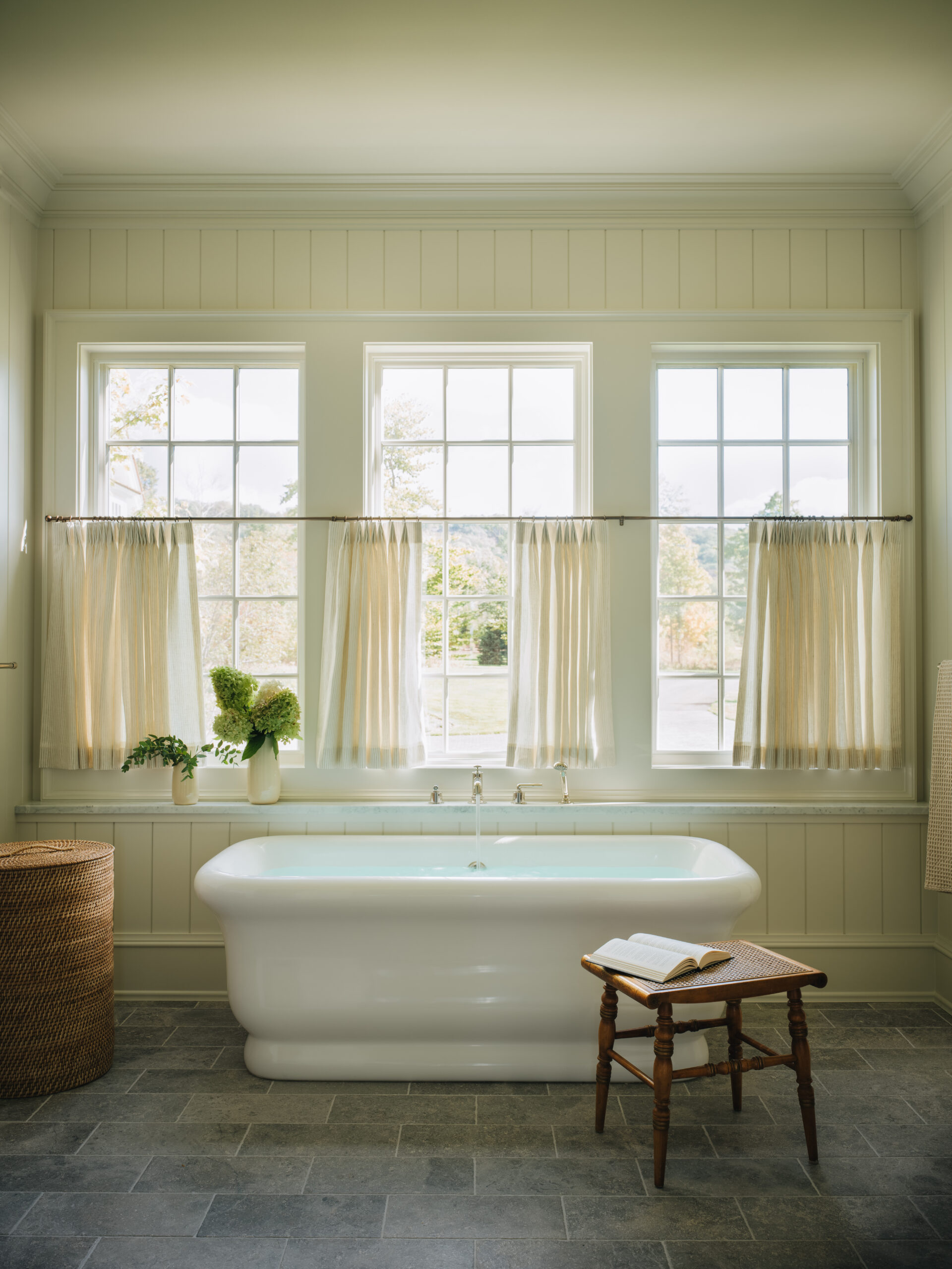 Spa-style bathroom in Glen Lake cottage with freestanding soaking tub and natural light